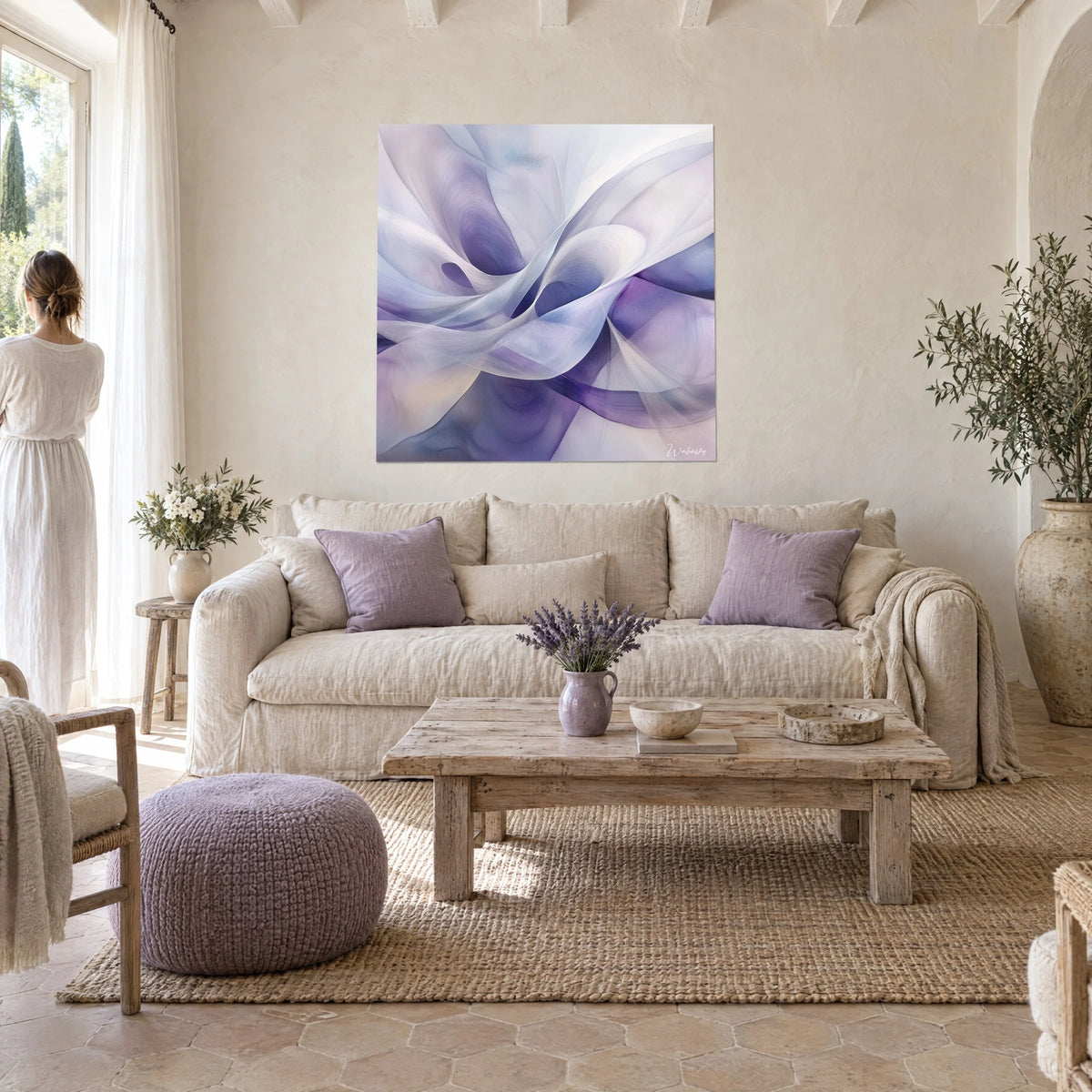 Wall art with violet and white silk veils floating in swirls, couple seen from behind, above a sofa in a bright living room