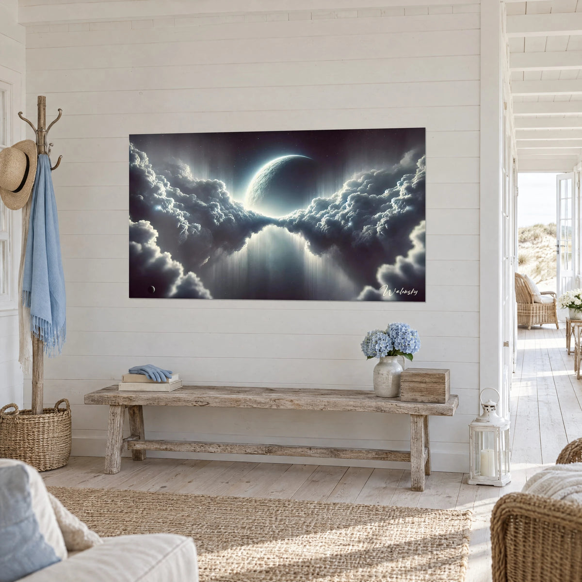 Wall art planet veiled in bluish mist, charcoal clouds lit with silver, hung three-quarter above a weathered bench