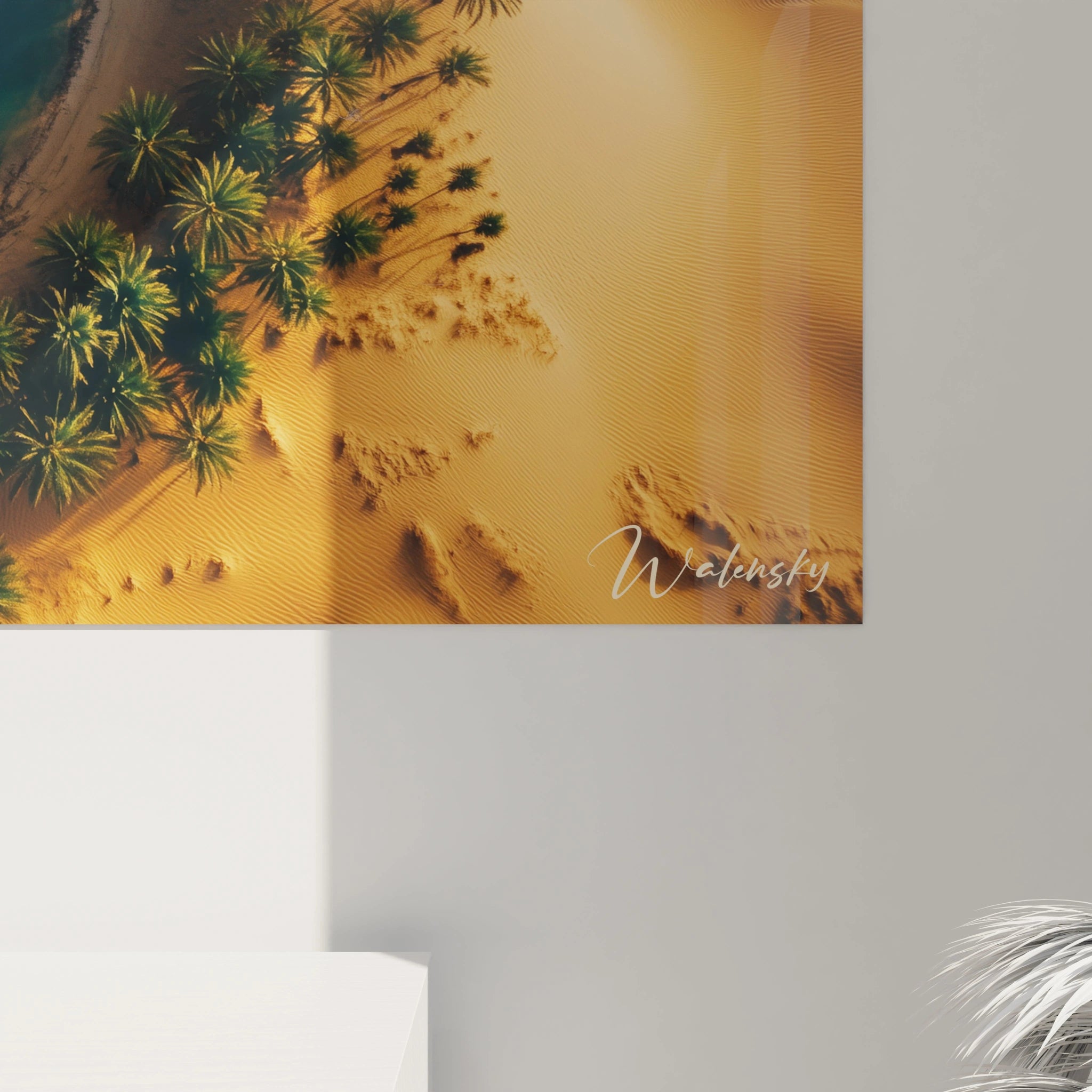 Un tableau paysage montrant un contraste marqué entre le désert aux teintes chaudes et une végétation verte autour d’un lac. Les ombres des palmiers et les variations de couleur donnent du relief à la scène.