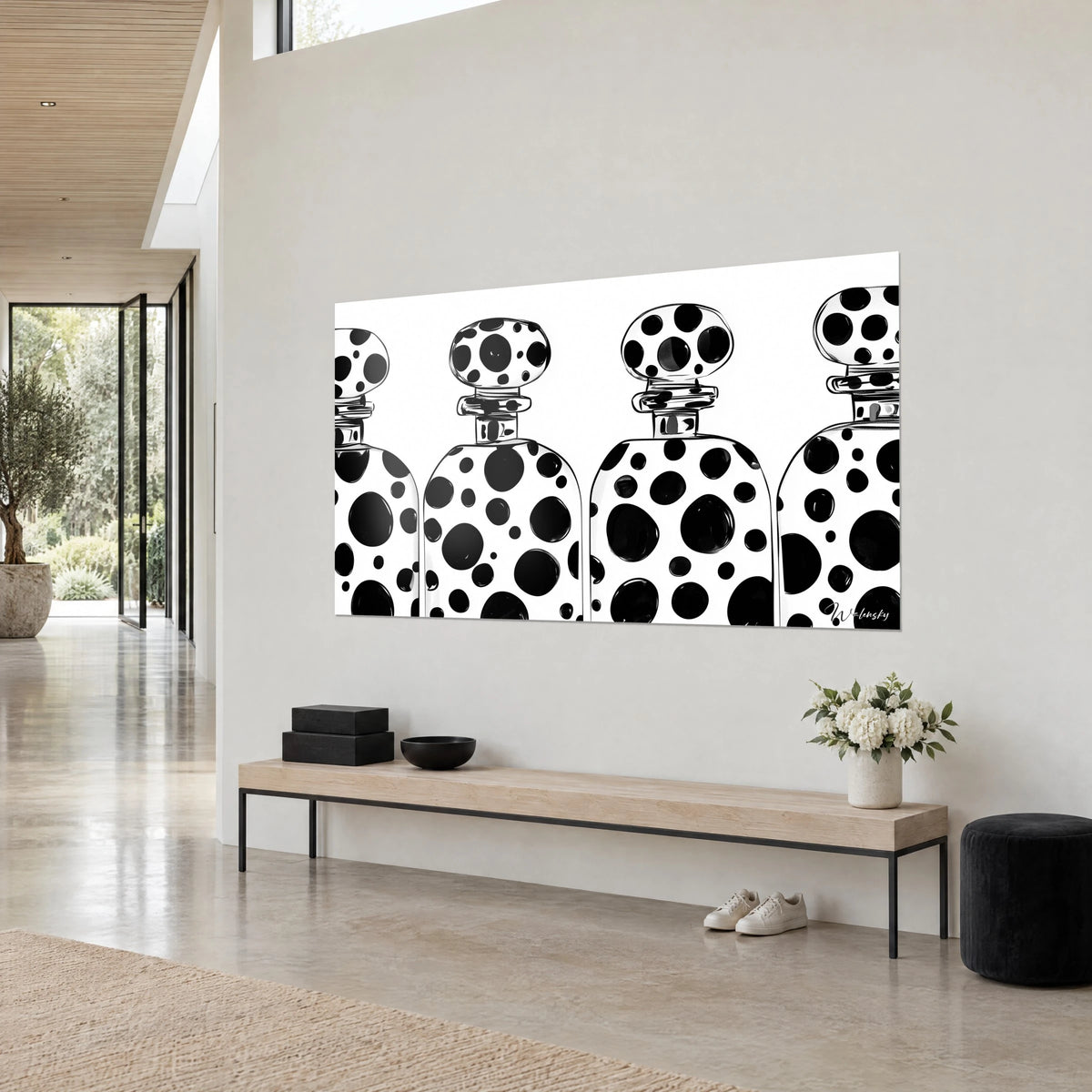 Wall art four decanters with bulbous stoppers, large black splashes on white, three-quarter view above a light wood bench
