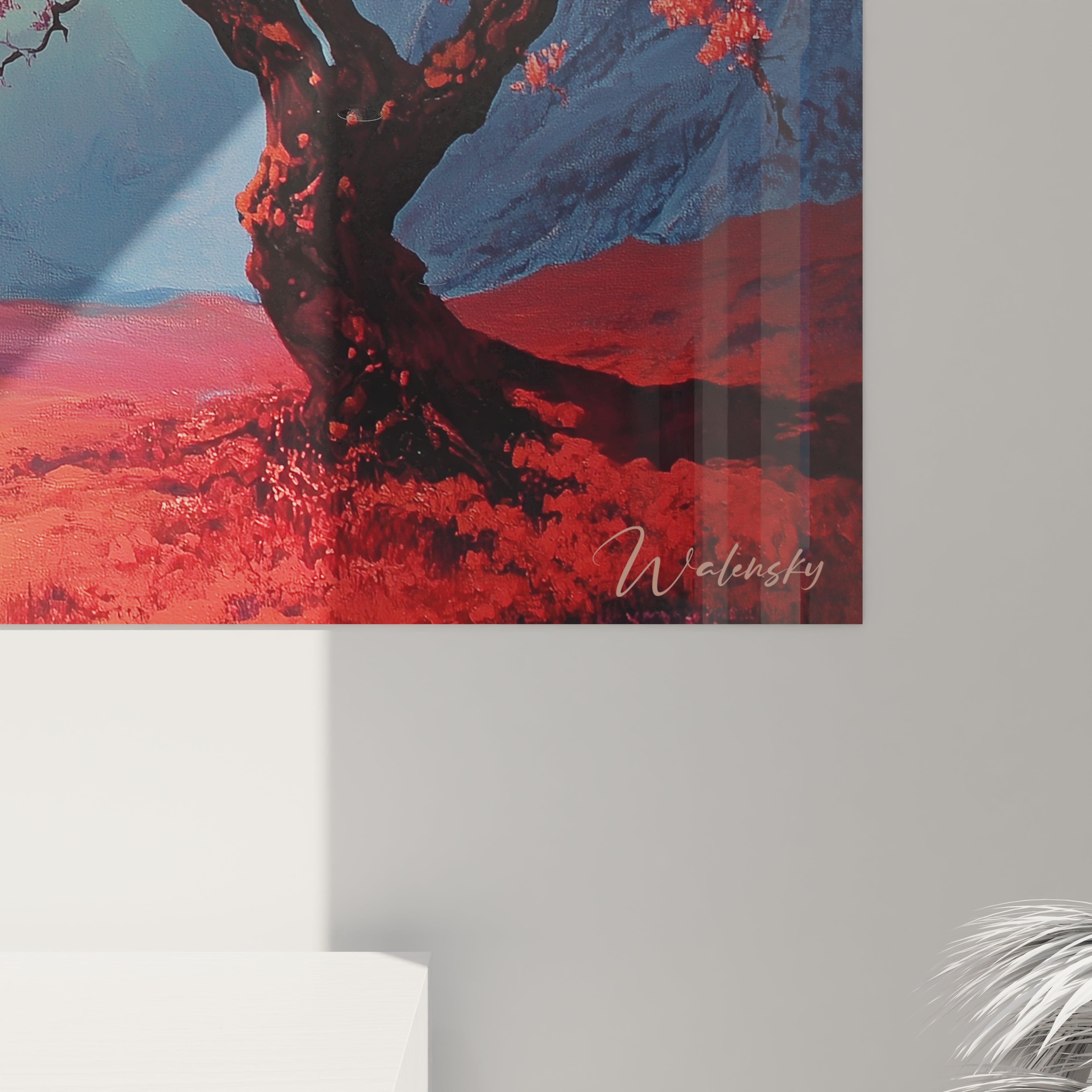 Composition moderne d'un tableau montagne où un arbre aux feuillages rouges se détache sur des cimes montagneuses bleues et violettes, avec des dégradés roses et orange au sol sous un ciel turquoise lumineux.