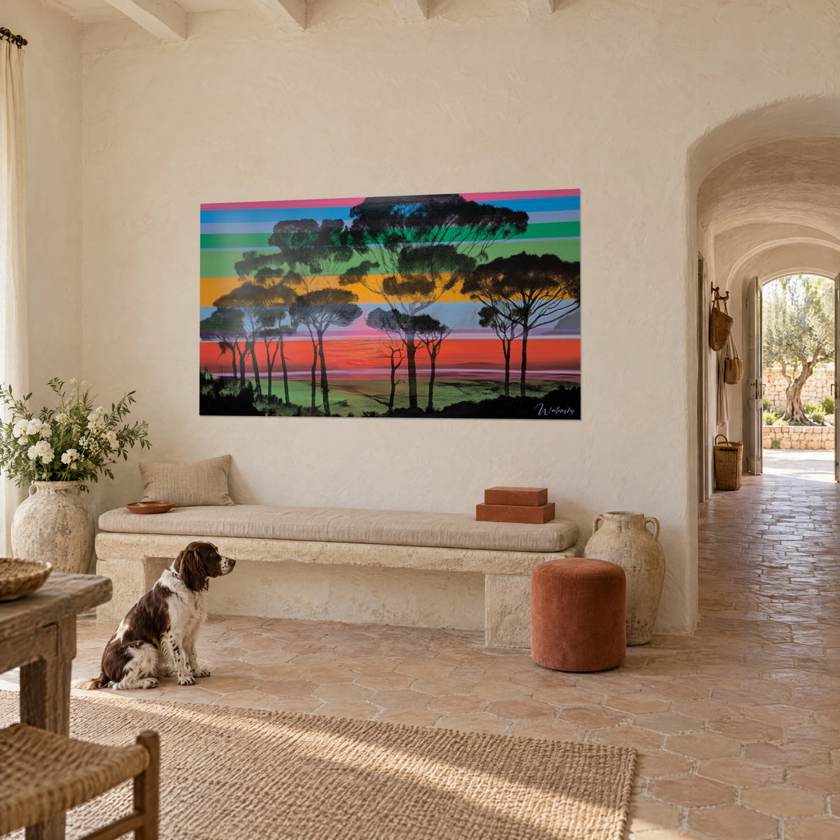 Wall art stand of maritime pines against an orange and turquoise striped sky, spaniel sitting in front, three-quarter view in a Provençal farmhouse