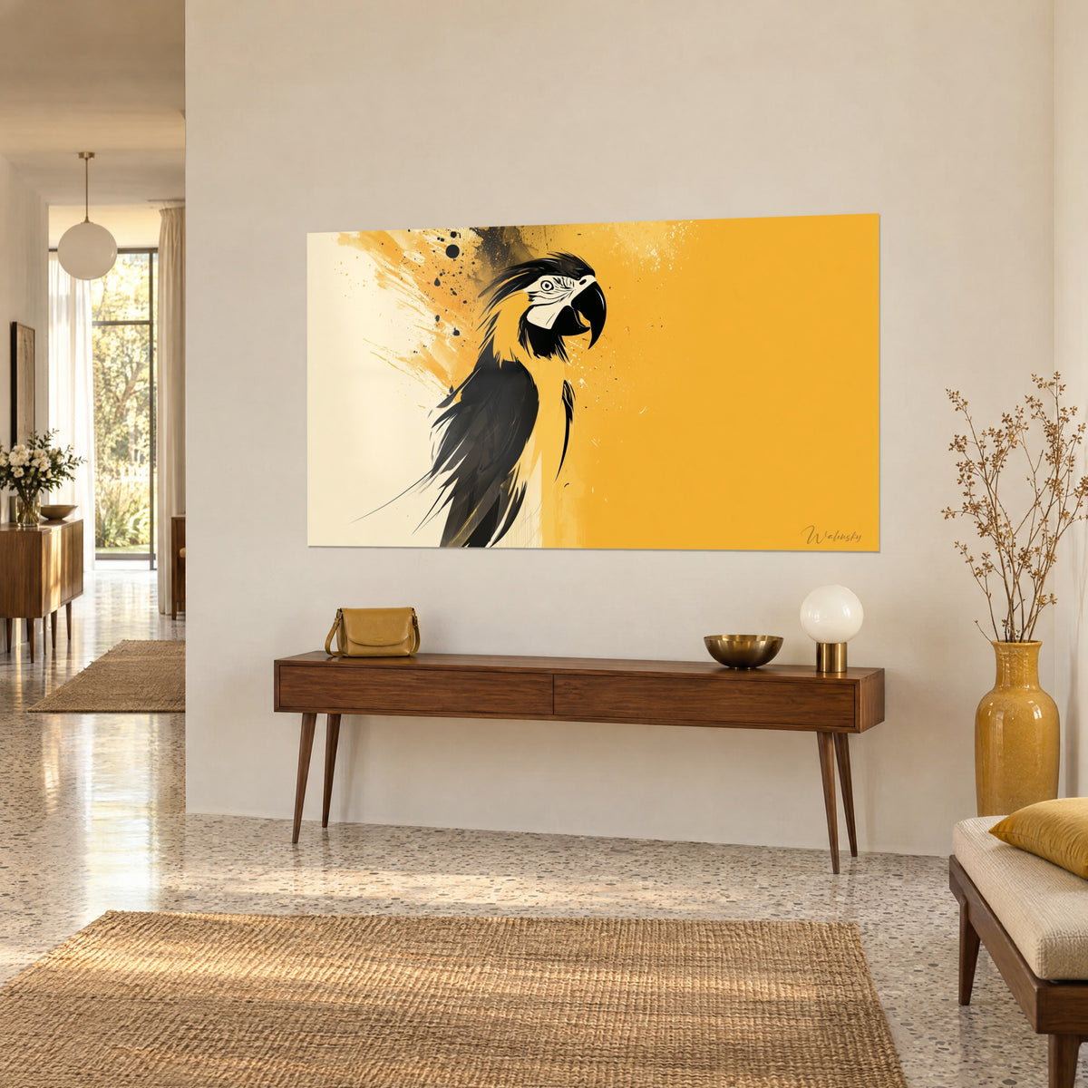Wall art exotic bird with black and gold plumage, cream on the left, three-quarter view on a beige wall above a wooden console