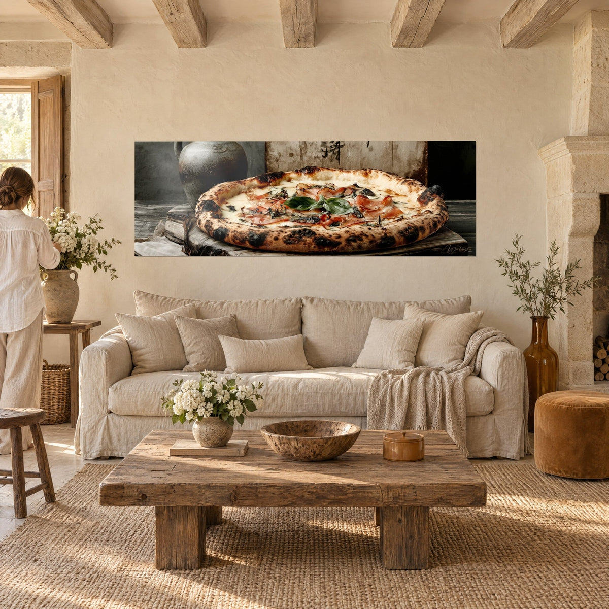Wall art Neapolitan pizza with a charred crust, pink ham and green basil, above a sofa in a bright living room