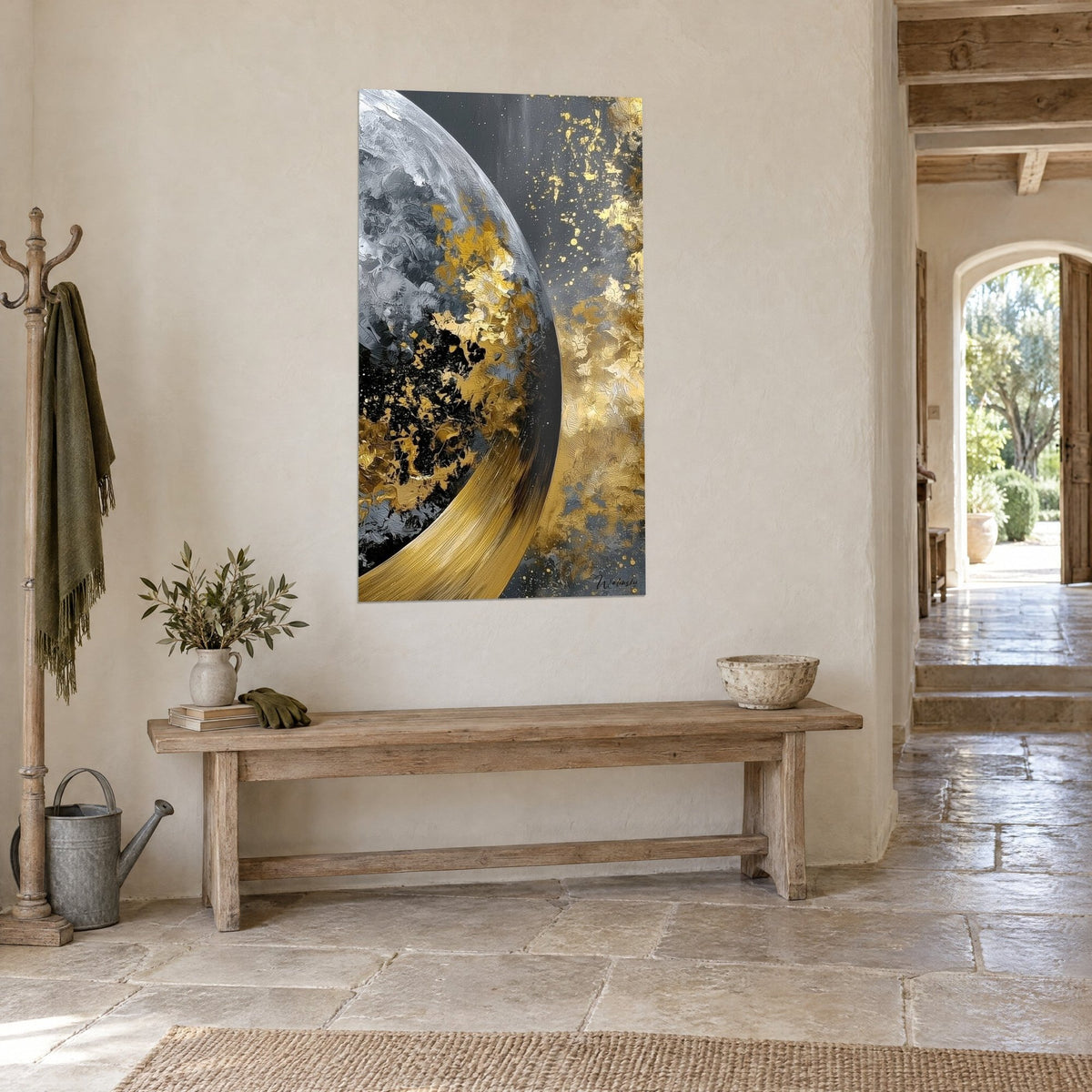 Wall art pearl grey moon globe splashed with gold, golden arc and charcoal background, three-quarter view on a light stone wall
