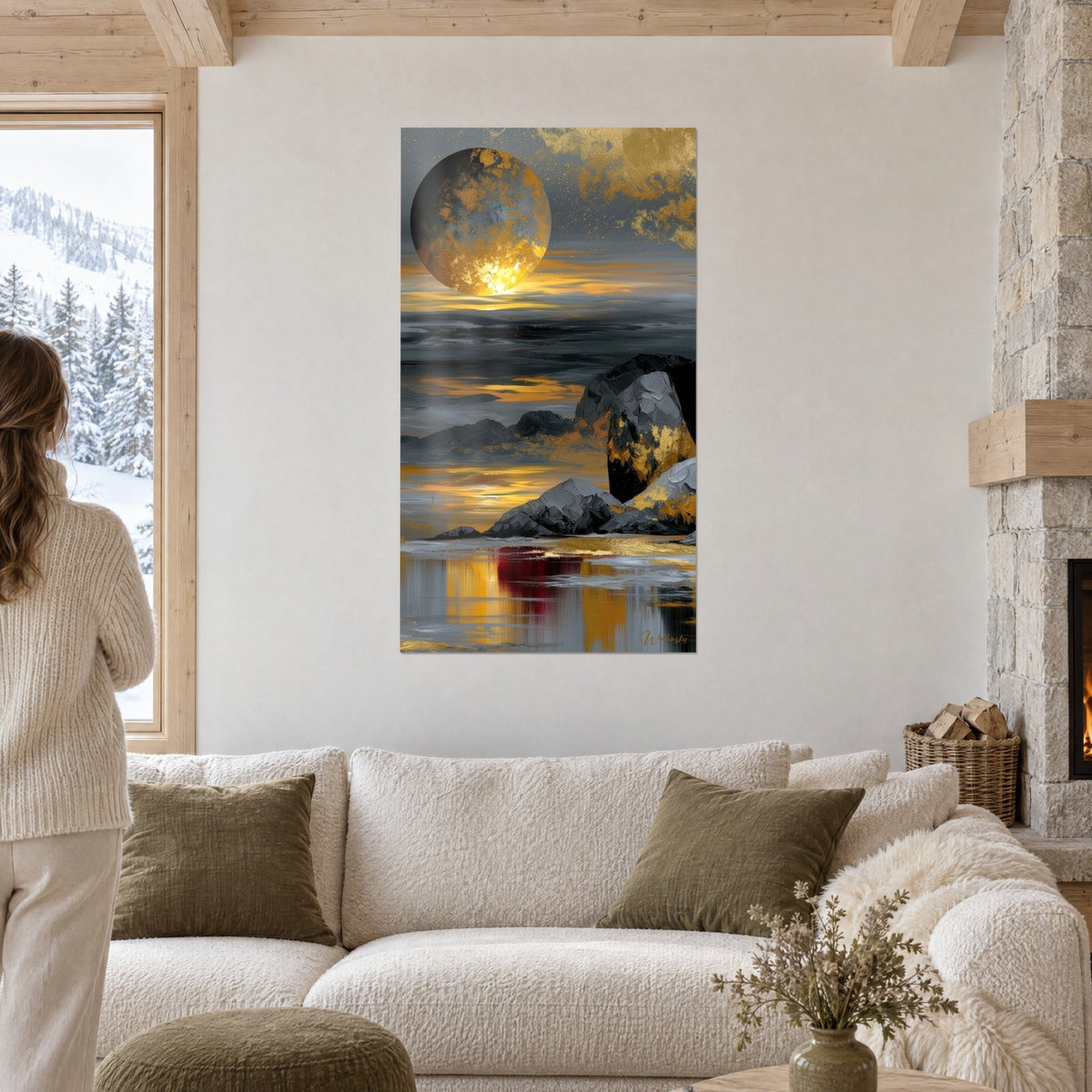 Wall art golden celestial body streaked with grey over dark rocks, deep red reflection on the water, above a sofa in a bright living room