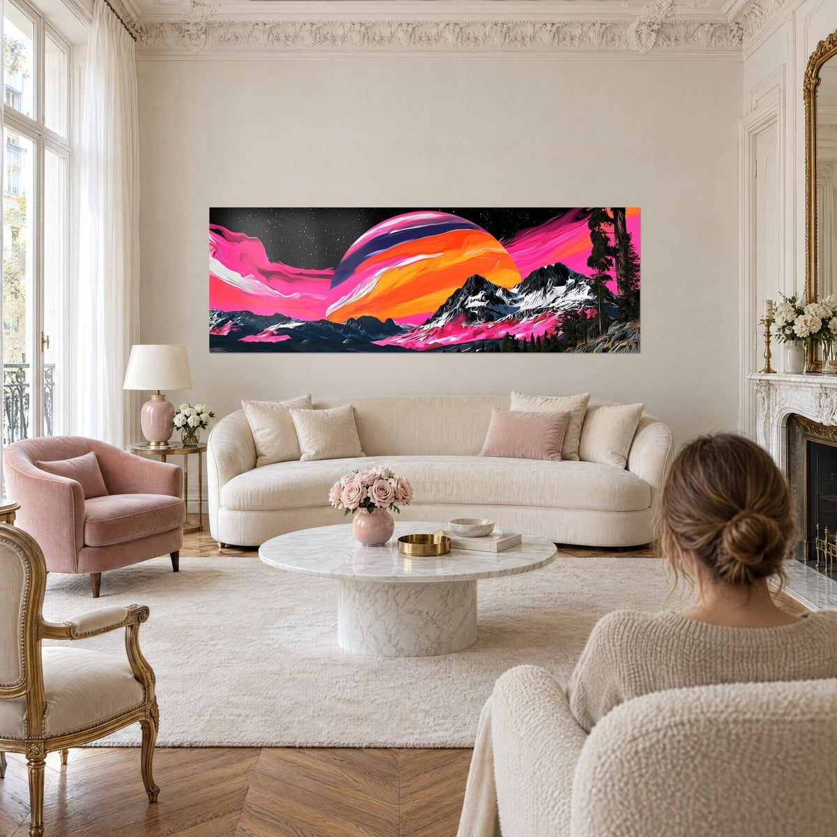 Wall art giant striped planet in orange and pink above snow-capped peaks, starry sky, hanging above a sofa in a bright living room