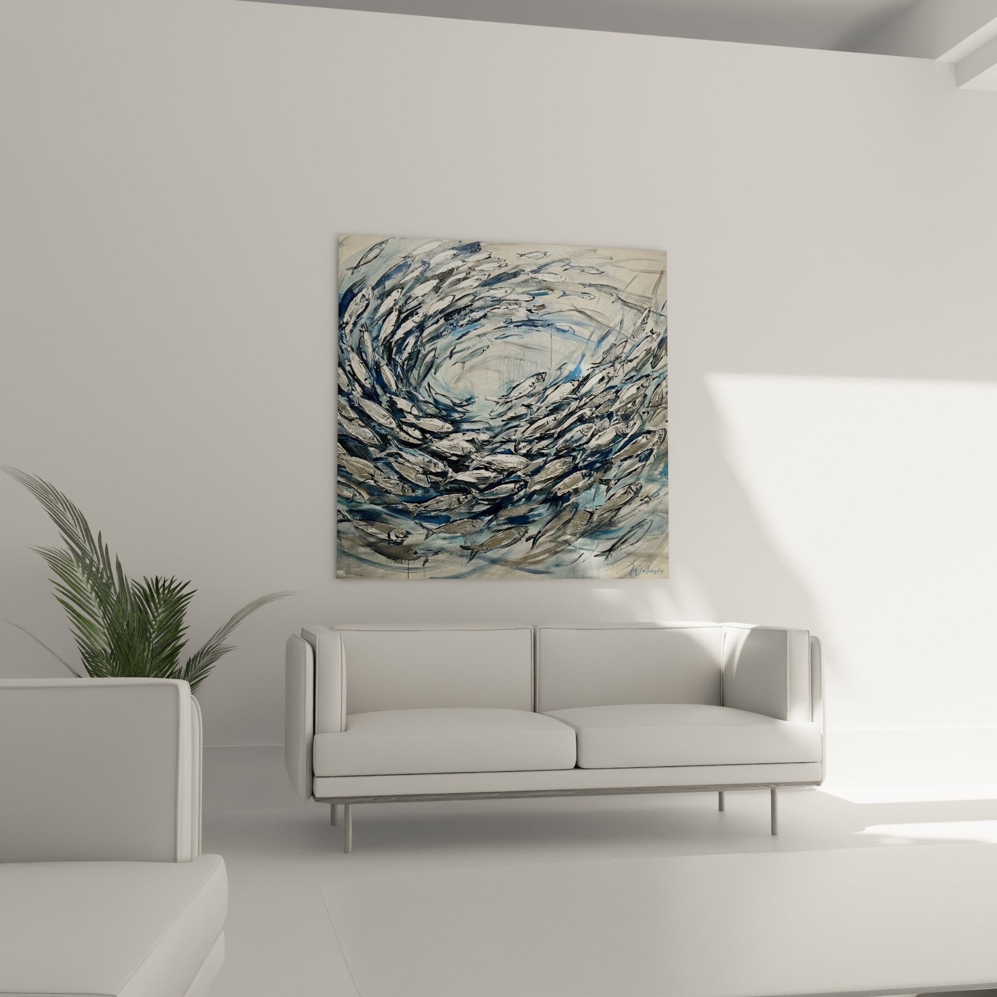 Spirale de poissons gris et blancs peints, disposée au-dessus d'un canapé dans un salon lumineux