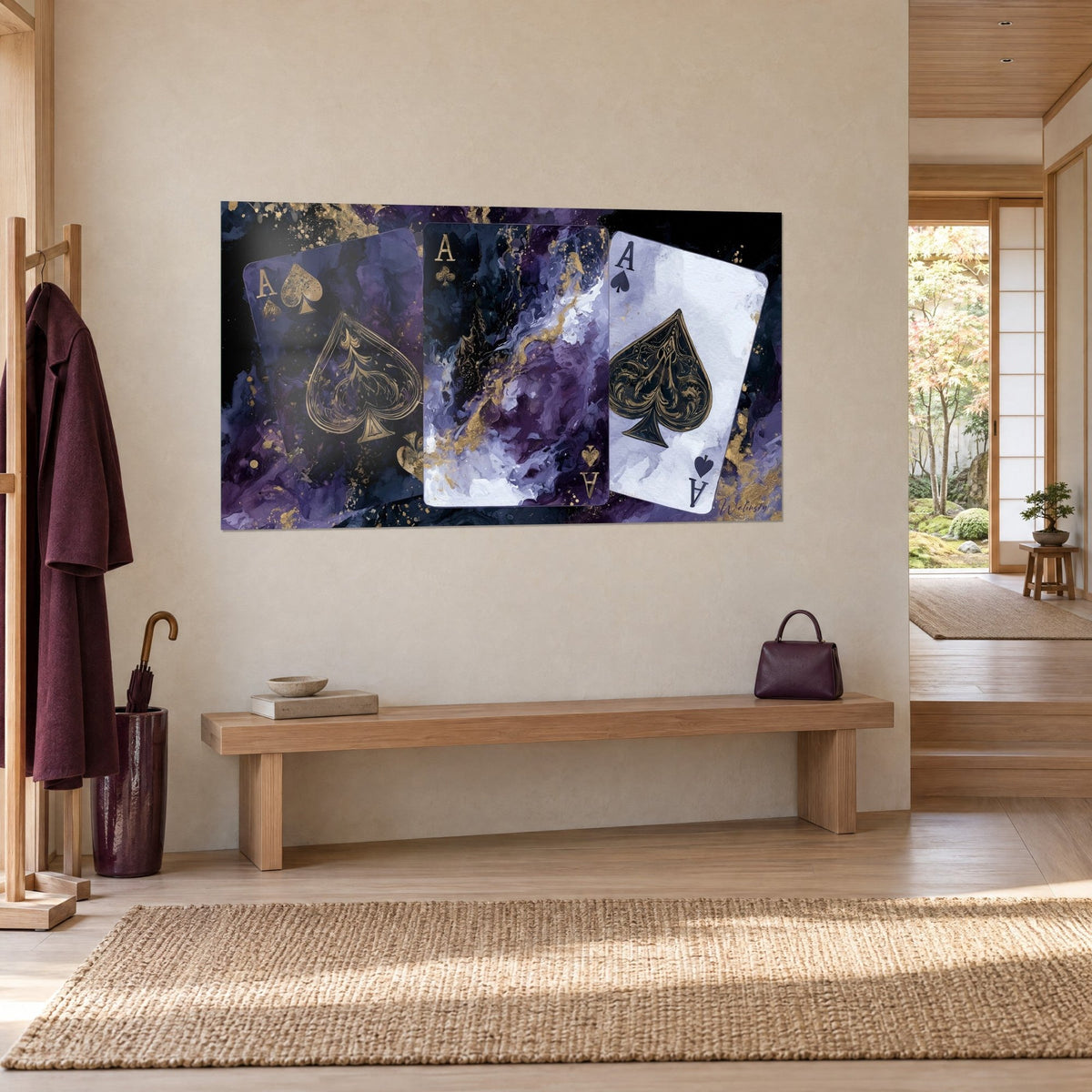Wall art of a three-ace poker hand, gold lines on plum and lavender marbling, three-quarter view near a bench
