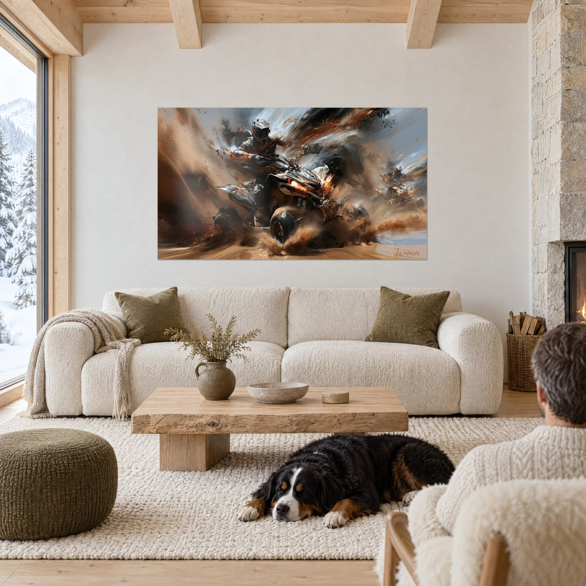 Wall art of a helmeted quad rider in a full mud slide, sand and orange spark sprays above a sofa in a bright living room