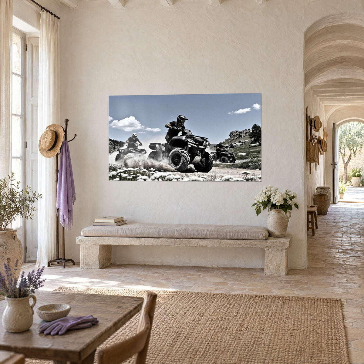Wall art of a helmeted rider leaning over his off-road vehicle, grey knobby tyres, pale earth and azure sky, in a vaulted hallway of the farmhouse