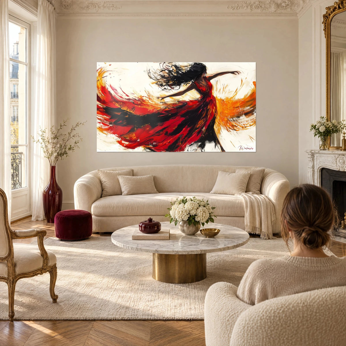 Wall art of a whirling flamenco dancer, red and black dress, orange color fields, above a sofa in a bright living room
