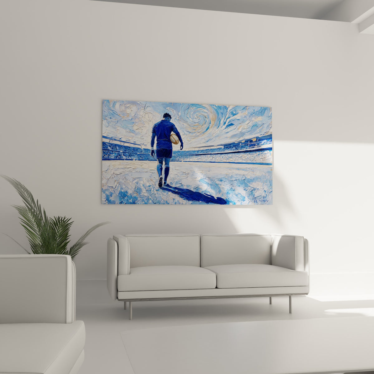 Homme en tenue bleue avançant sur le terrain blanc, tableau placé au-dessus d'un canapé dans un salon lumineux