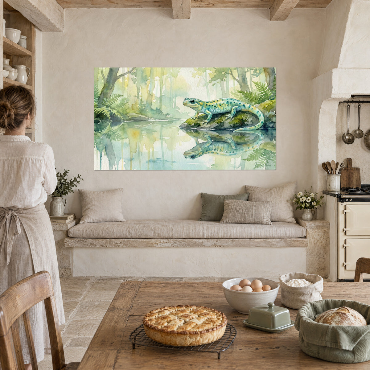 Wall art blue-green water lizard on its mossy rock, faded pale tree trunks in the background, woman from behind in an apron in front, pie on the table of the vaulted kitchen
