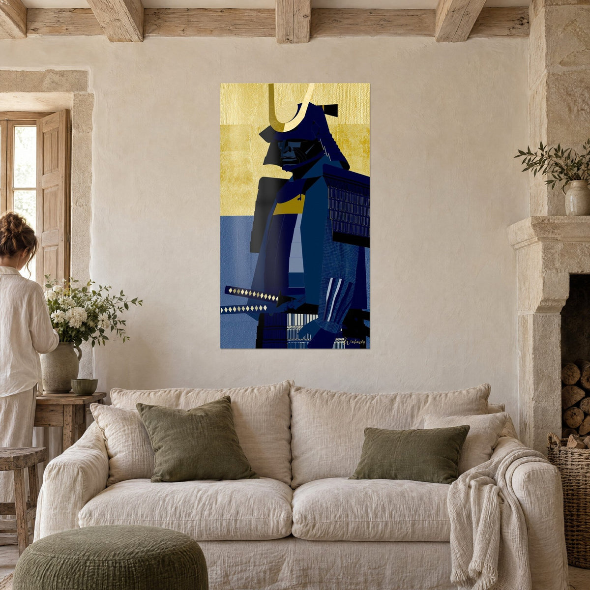 Wall art samurai in navy blue armor, black helmet with gold crescent, crumpled gold background, person seen from behind above a sofa in a bright living room