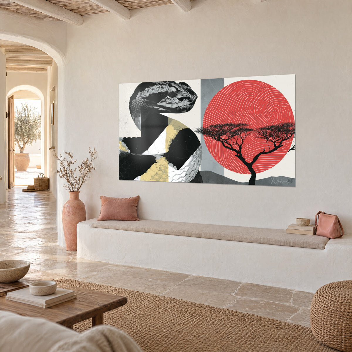 Wall art of a viper with grey scales facing a spiral coral sun, black acacia, beige wall of a Mediterranean house