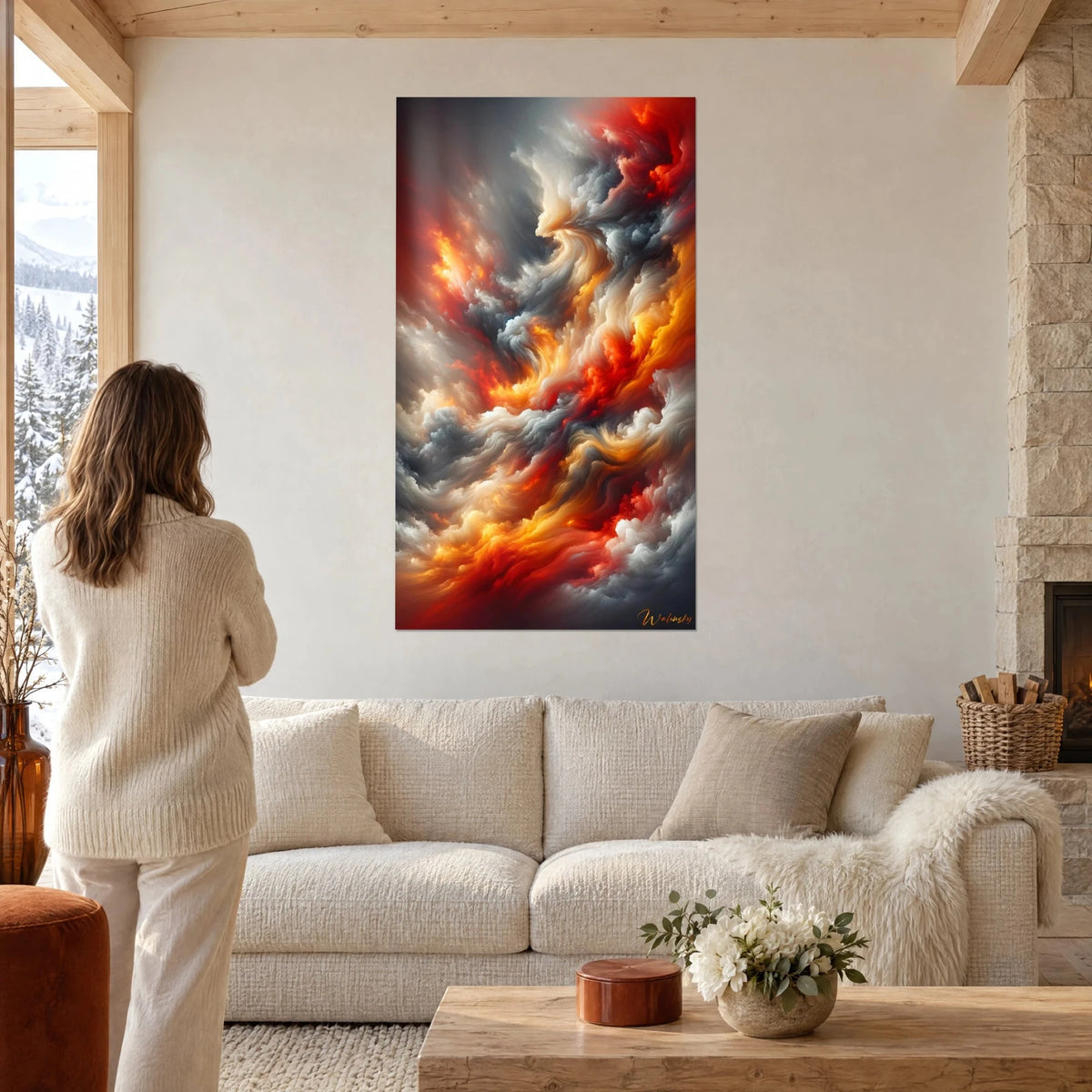 Wall art swirl of scarlet flames and pearl-grey clouds, woman seen from behind, above a sofa in a bright living room