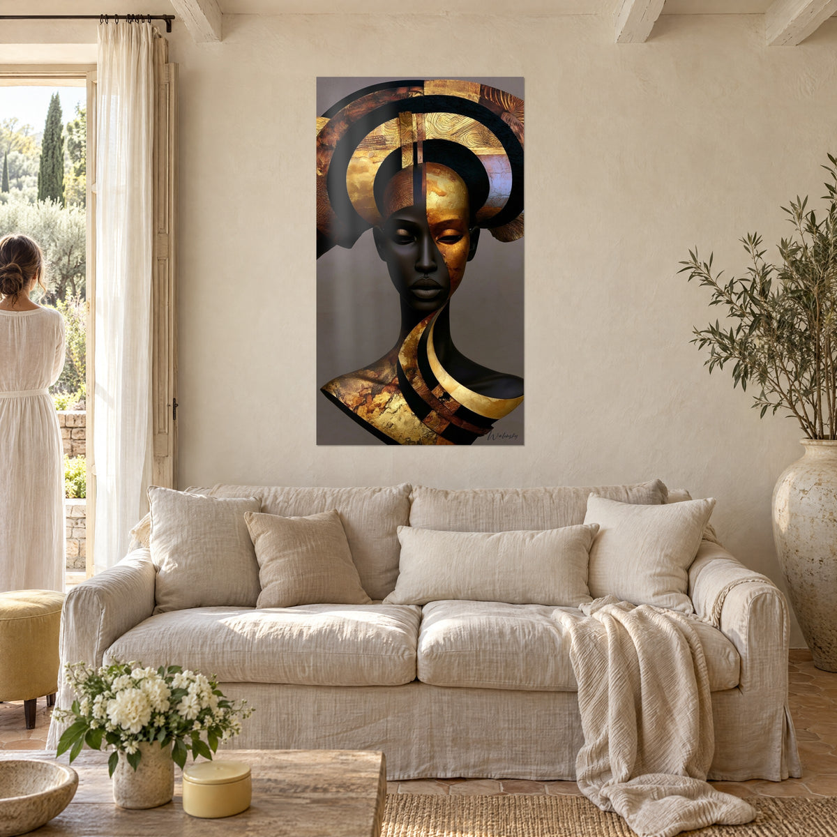 Wall art black woman bust with golden headpiece of concentric arches, bronze and gold, two figures seen from behind, above a sofa in a bright living room