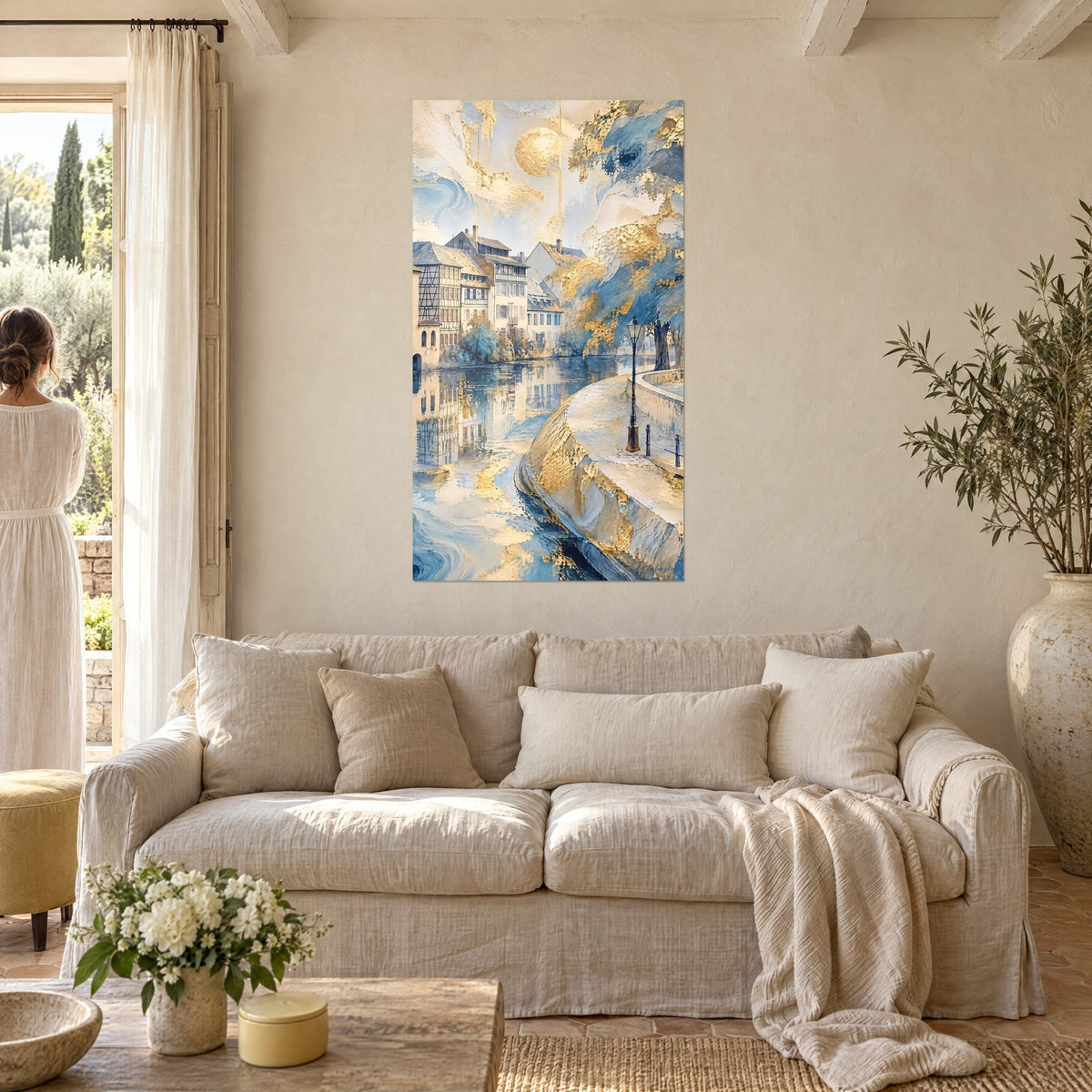 Wall art golden and blue cobbled quay, round sun over half-timbered houses, above a sofa in a bright living room