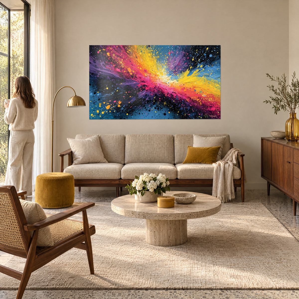 Wall art explosion of pink and yellow paint in a star shape on black and blue background, vivid splashes, above a sofa in a bright living room