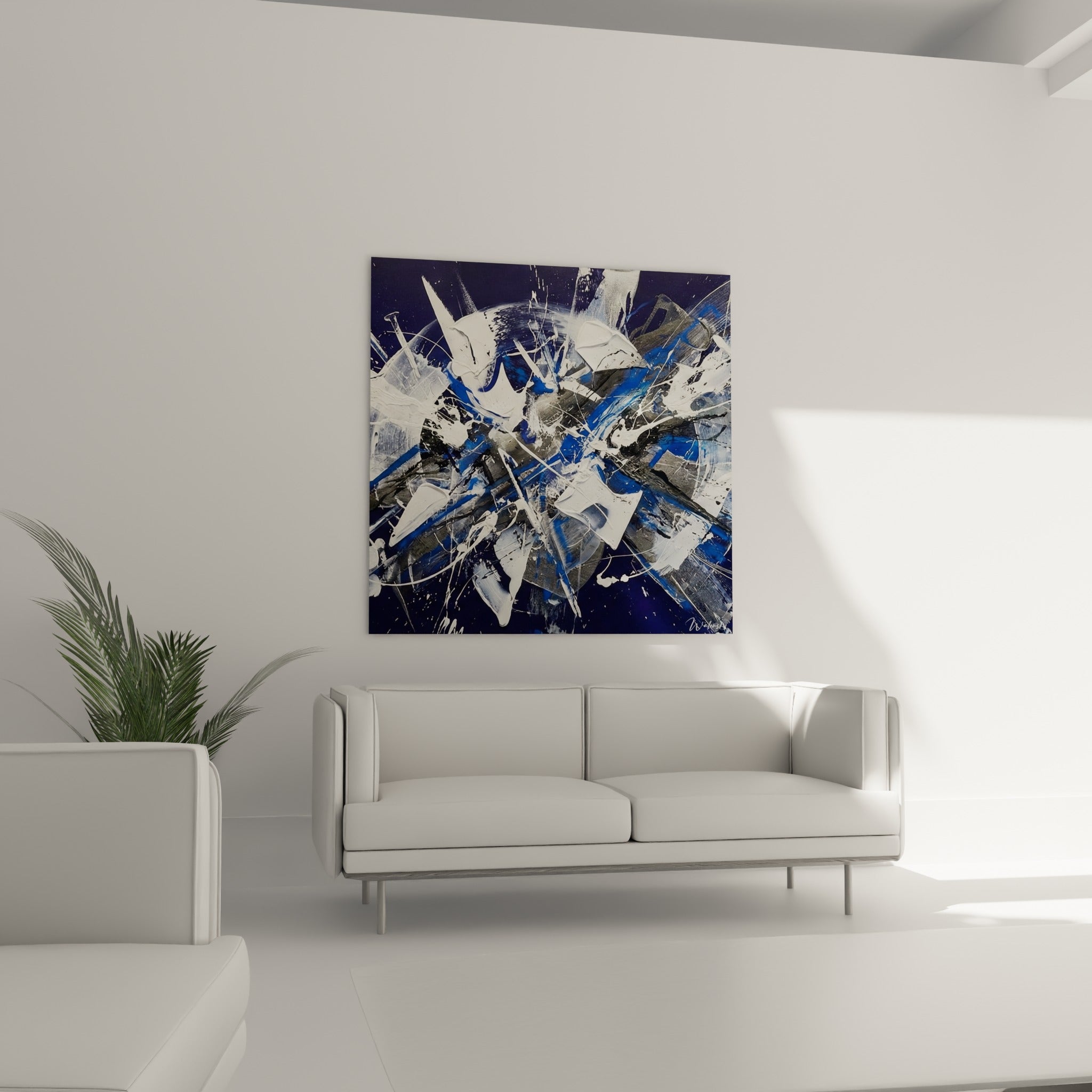 Traits anthracite et coulures blanches de ce tableau style peinture au-dessus d'un canapé dans un salon lumineux