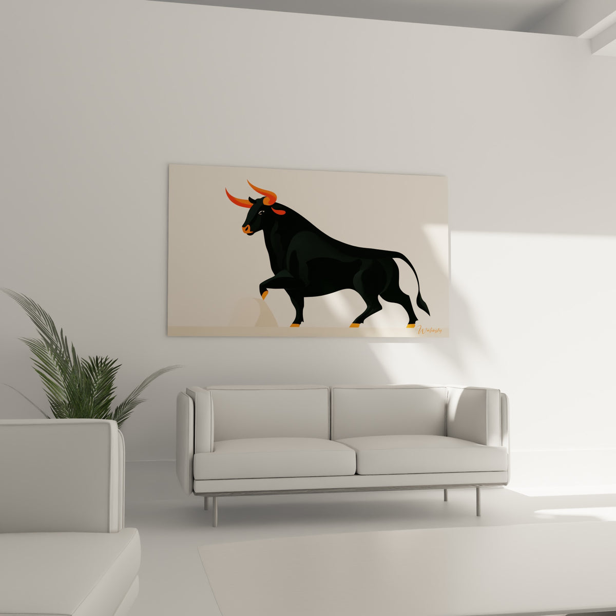 Animal graphique noir aux cornes orange placé au-dessus d'un canapé dans un salon lumineux