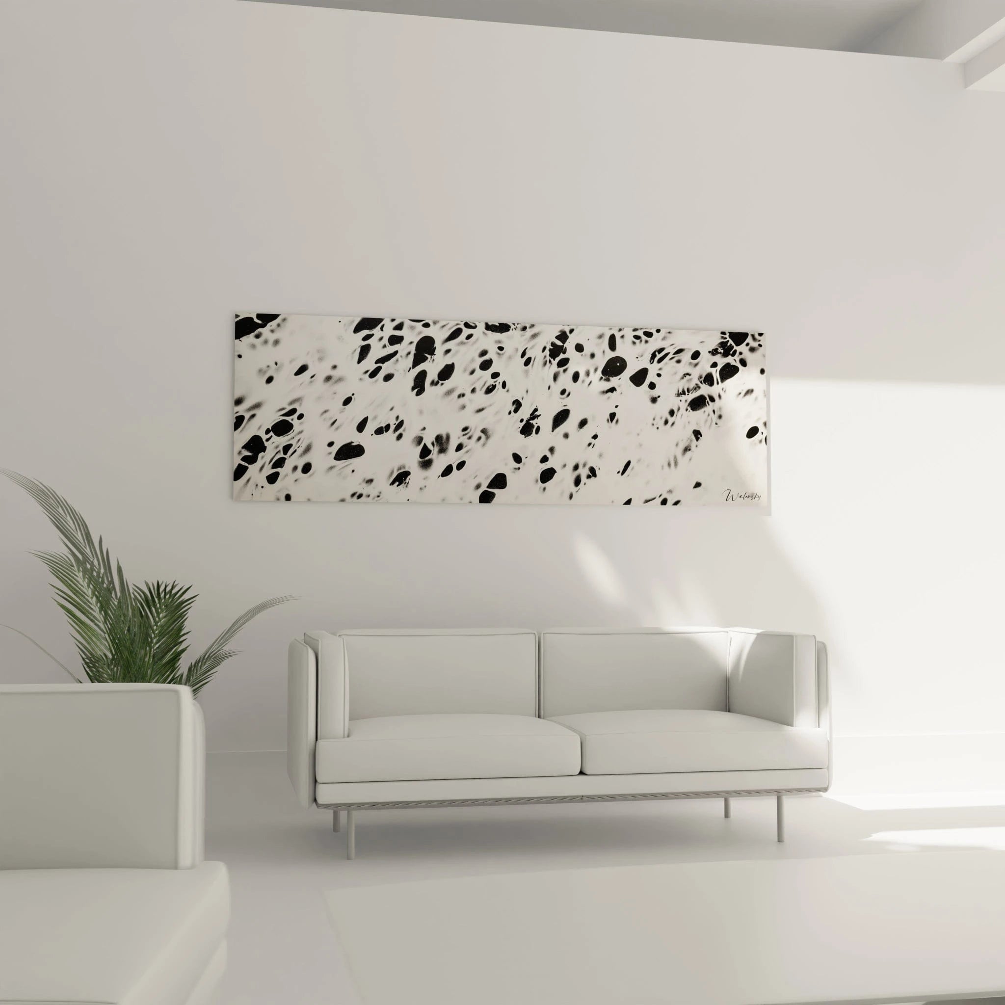 Tableau tacheté noir et blanc de Walensky décorant un salon moderne avec un canapé blanc