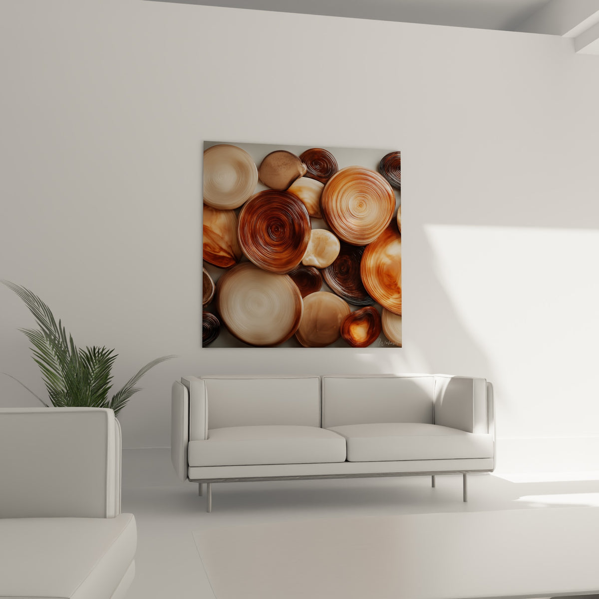 Pierres ovales ocre et anthracite aux textures satinées, suspendues au-dessus d'un canapé dans un salon lumineux
