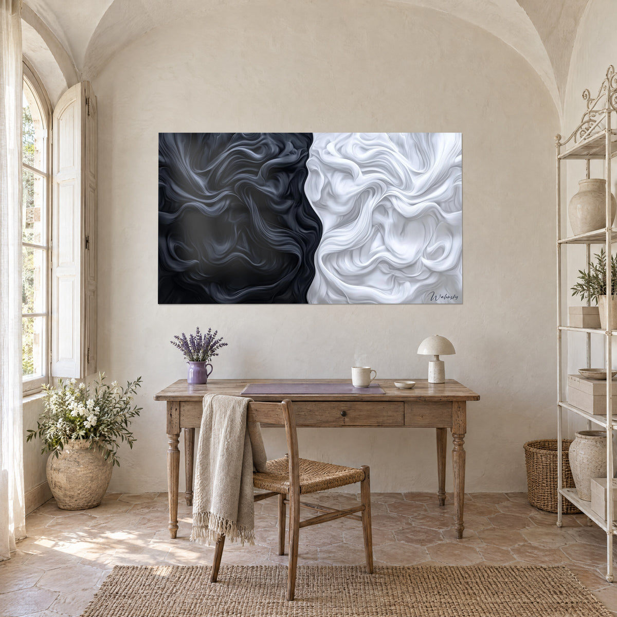 Wall art of fluid marbling, one half obsidian and the other porcelain, above a light wood desk and a mushroom lamp