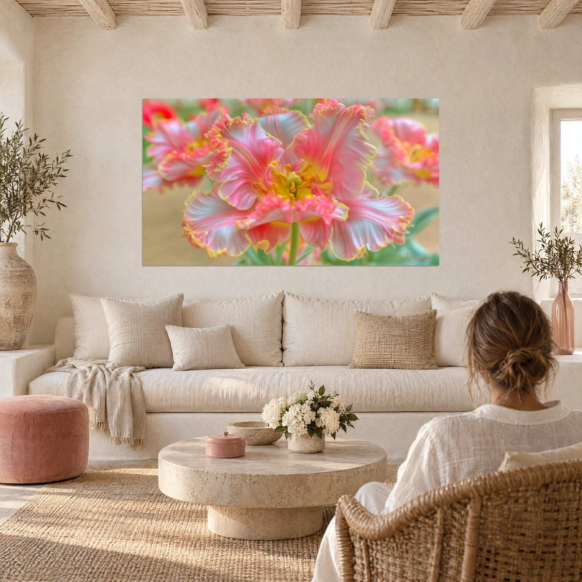 Wall art parrot tulip in pink and white with fringed petals, bright yellow center, above a sofa in a bright living room