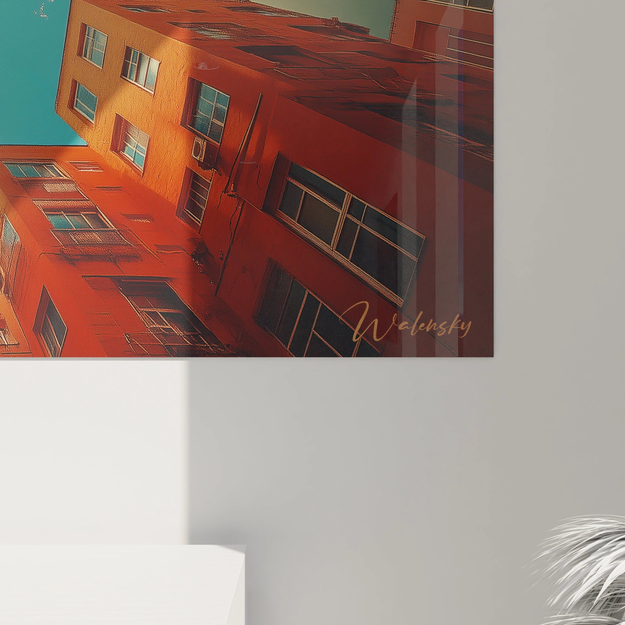 Tableau mural street art de Walensky avec des bâtiments orange sous un ciel bleu