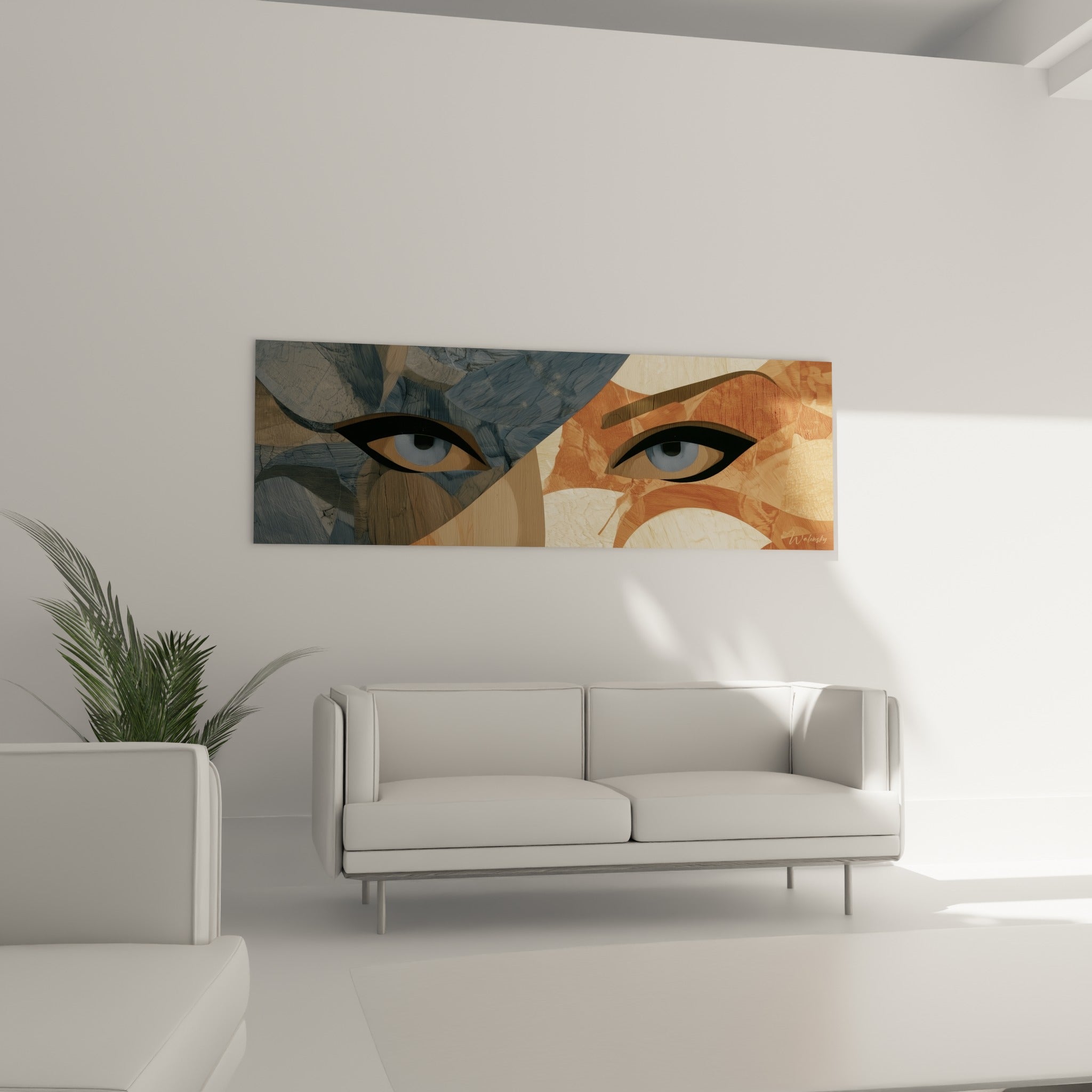 Composition graphique bleu gris et terracotta d'un visage abstrait, au-dessus d'un canapé dans un salon lumineux
