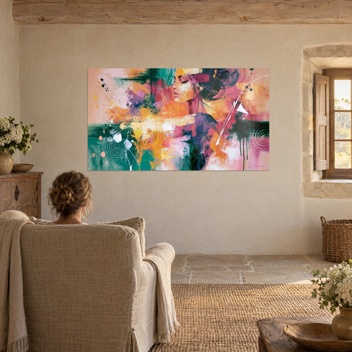 Wall art muse with pink lips, orange and turquoise color blocks, white streaks, beige wall of a stone living room