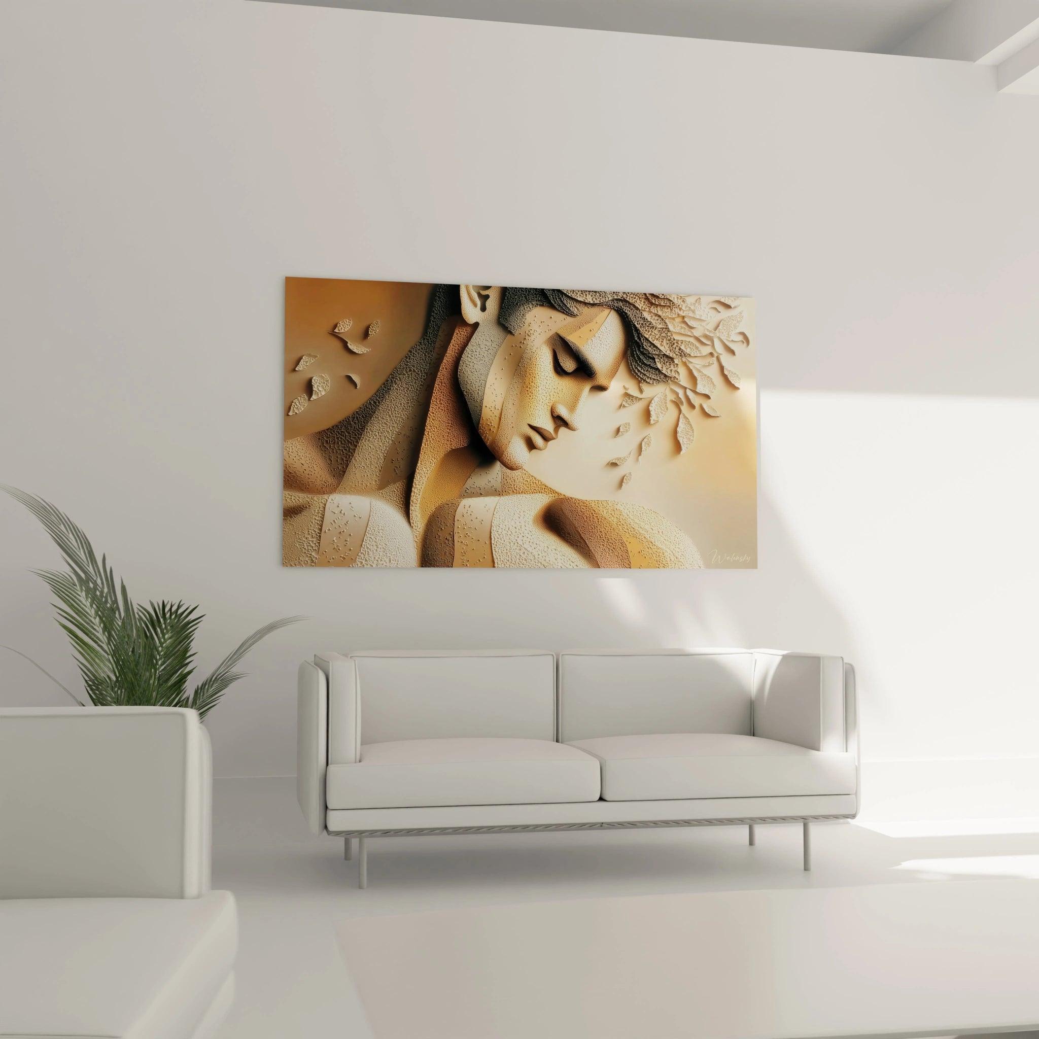 Tableau visage sculpté homme stylisé sur un mur moderne avec un canapé blanc