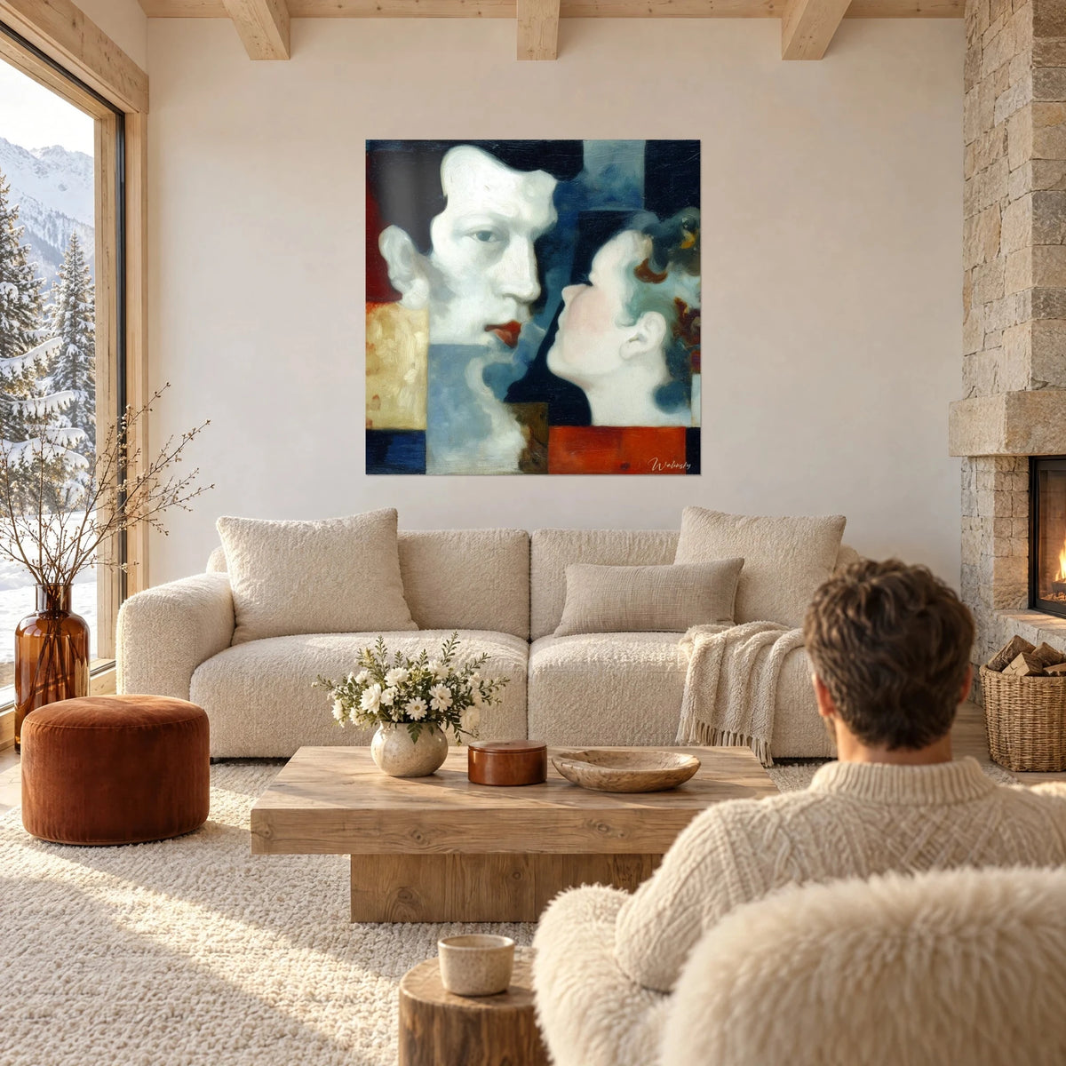 Tableau deux profils face à face, visage blanc et bouche rouge, fond bleu et ocre, au-dessus d'un canapé dans un salon lumineux