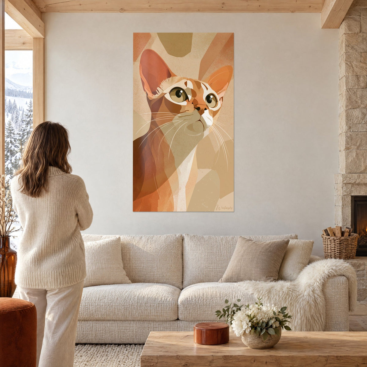 Wall art Singapura cat with large golden eyes, red and beige coat, a woman seen from behind above a sofa in a bright living room