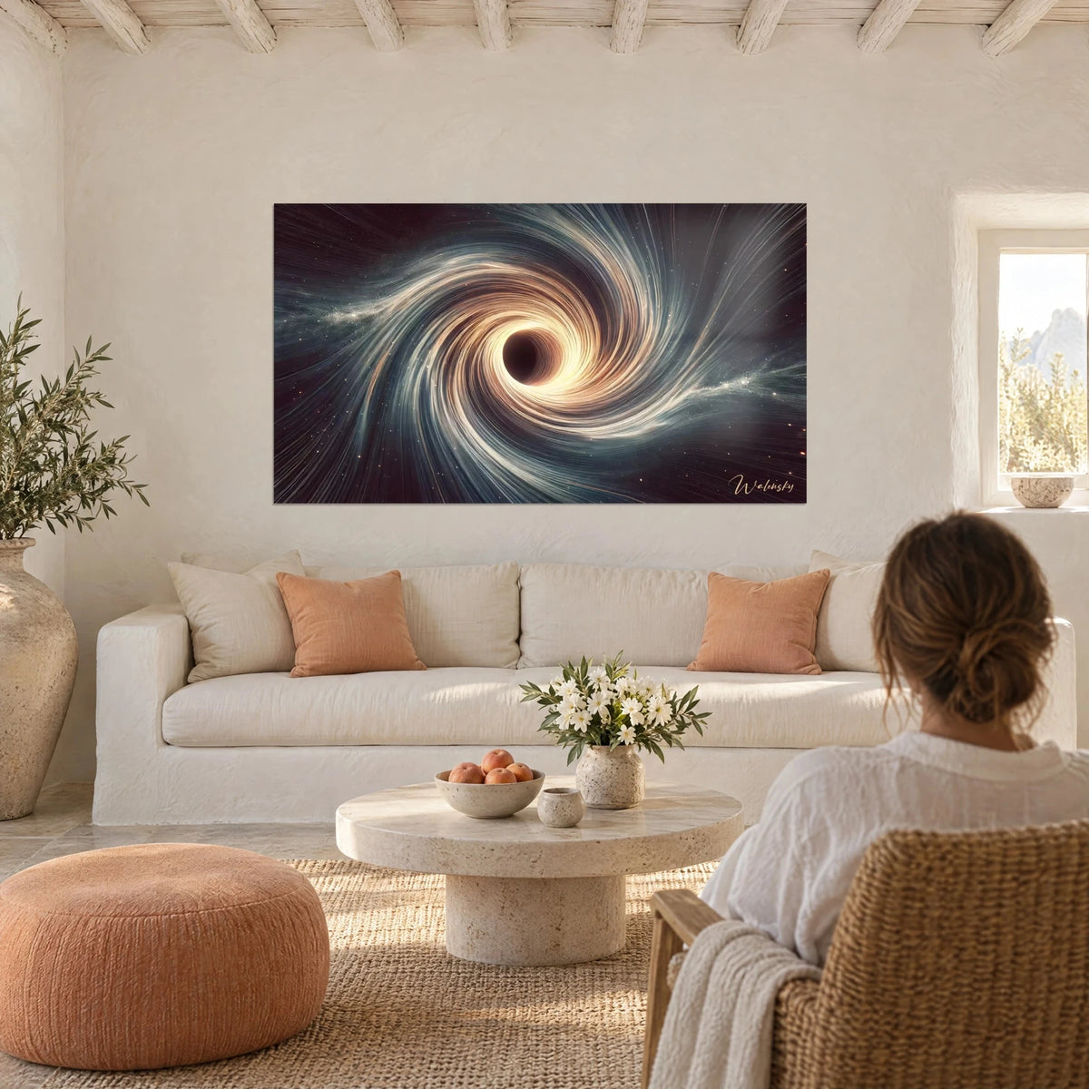 Wall art black hole ringed by a glowing amber disc, blue-grey swirls on a burgundy background, above a sofa in a bright living room