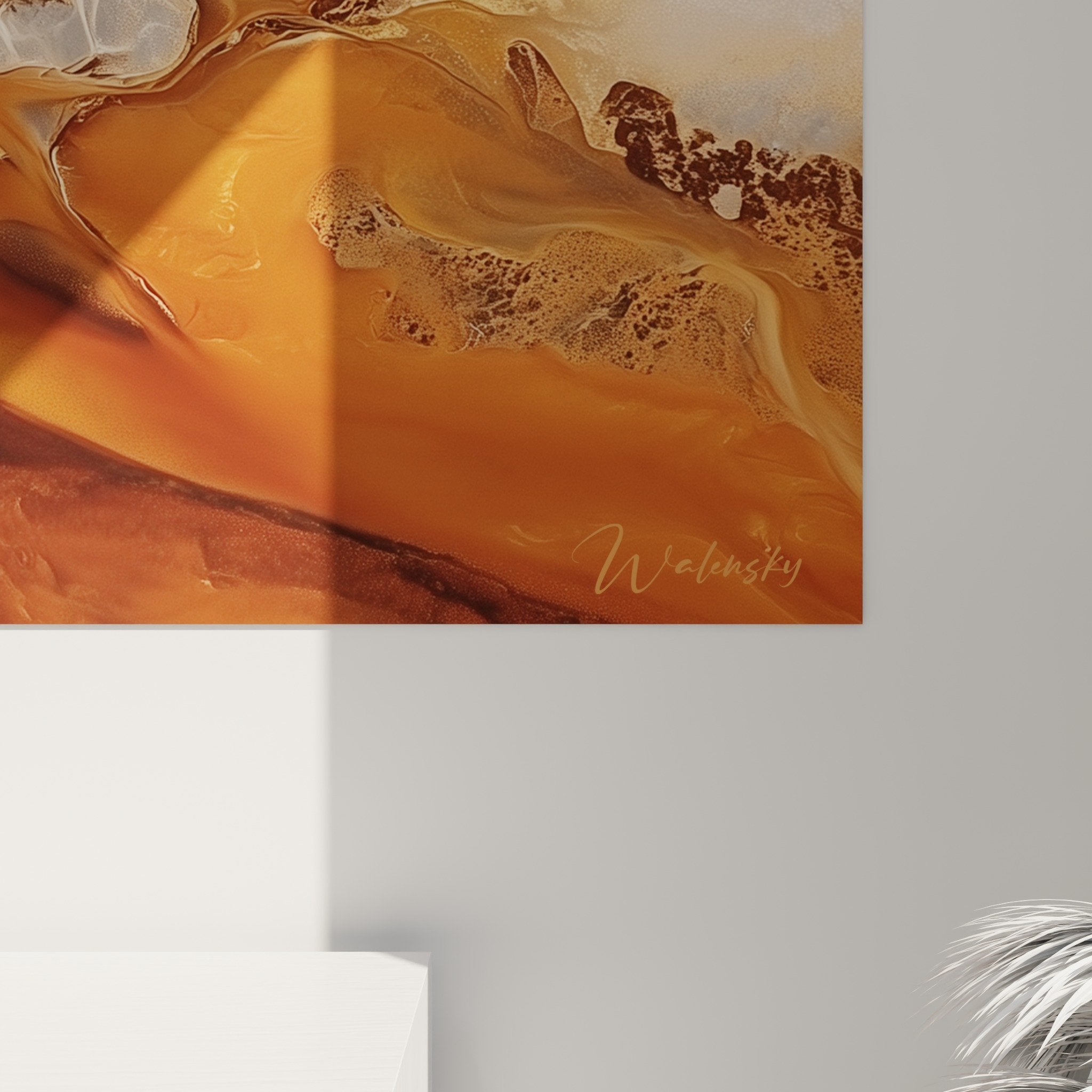 Overview of abstract African painting in modern interior with warm colors and golden reflections