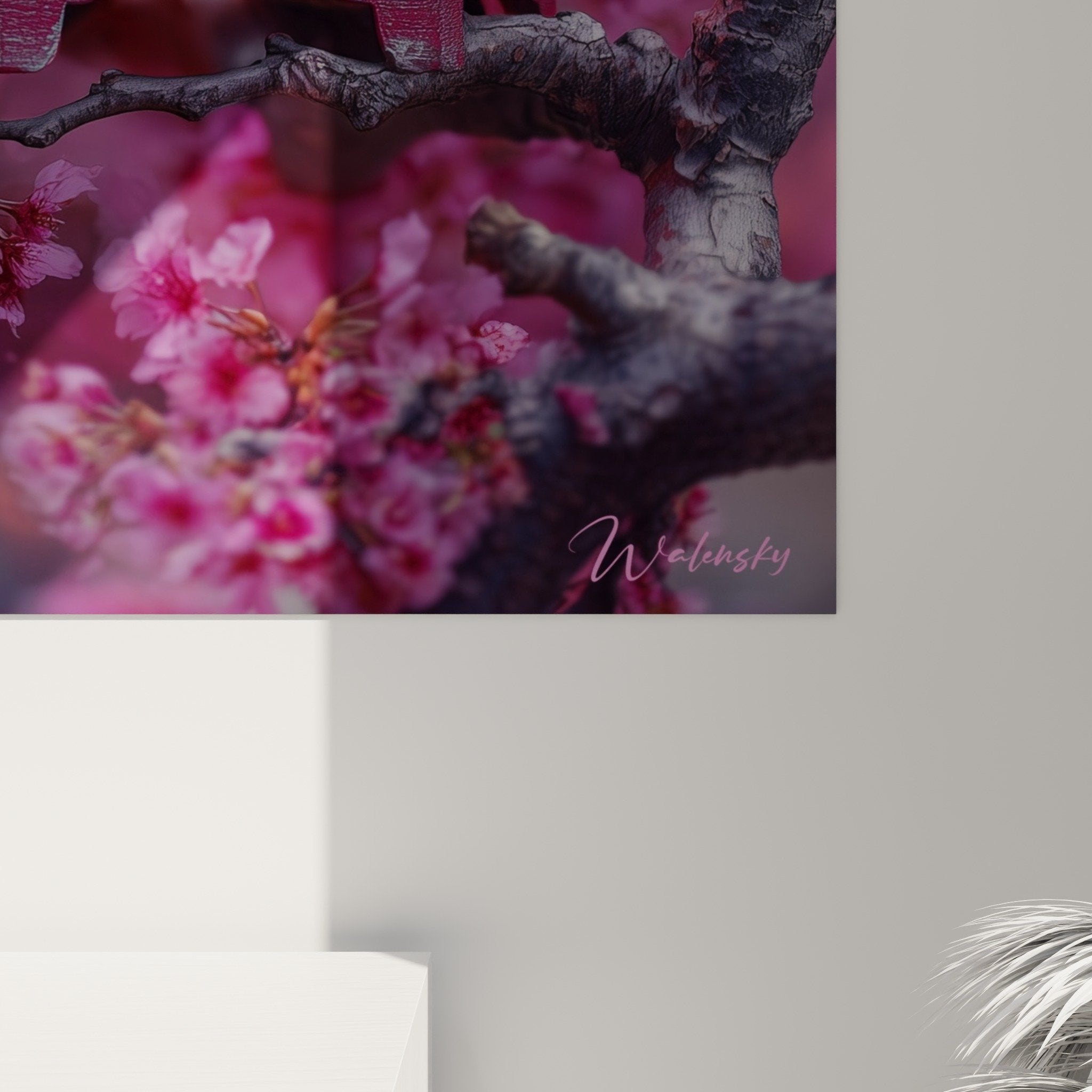 Overview of zen composition with illuminated lantern, flowering cherry blossom branches against pink-purple background