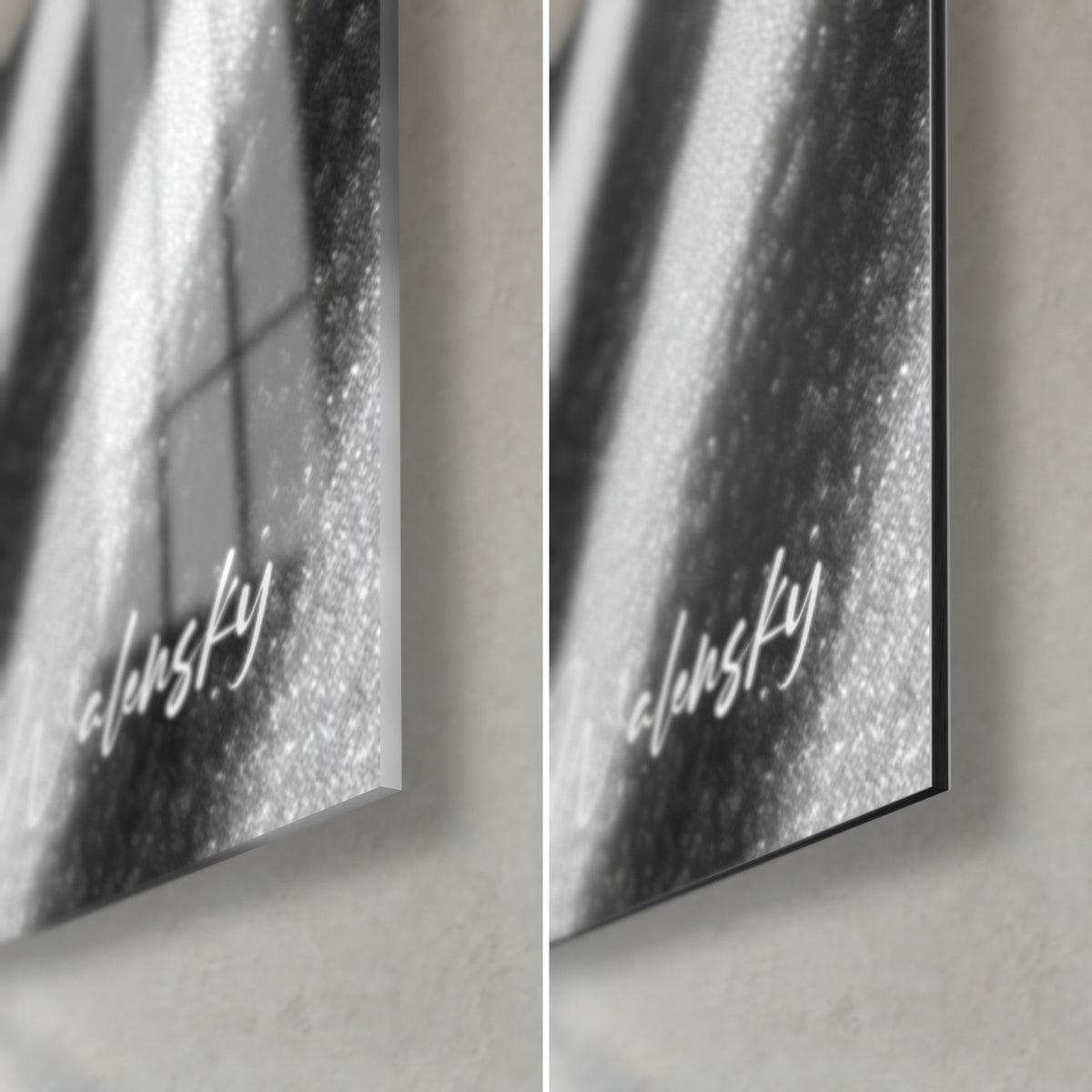 Wall art pebble on wavy grey and white sand, lower right corner: glossy acrylic glass on the left, matte black Dibond on the right