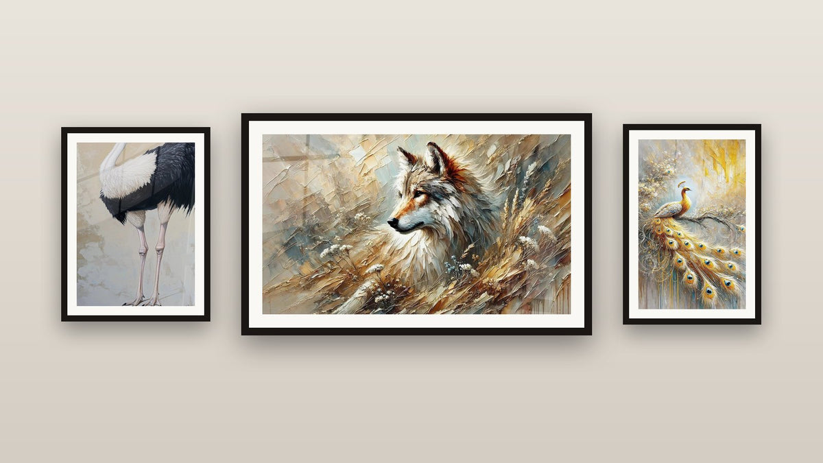 Gallery wall with three framed paintings, including Golden Wings and Echo of the Forest