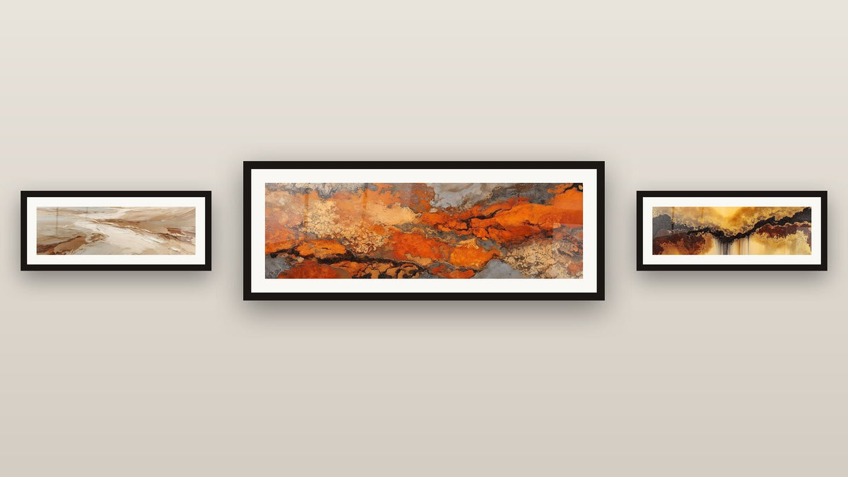 Gallery wall with three framed paintings, including Abstract Golden and Ochre Flows