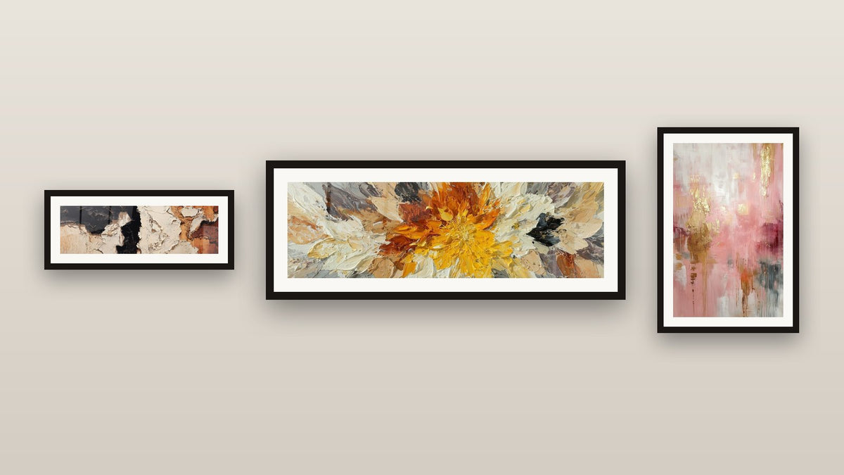 Gallery wall with three framed paintings