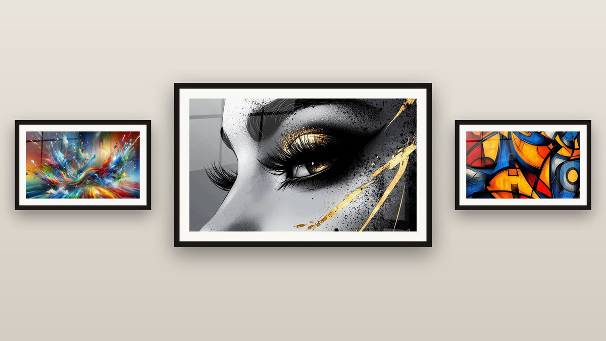 Gallery wall with three framed paintings: Big Bang Artistic Dazzling, Colored geometric shapes and Golden Tear Eye