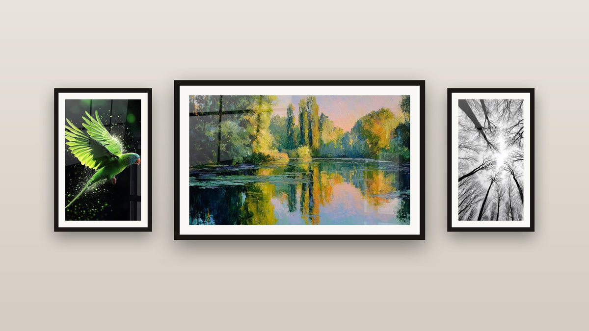 Gallery wall with three framed paintings: Forest Overhead View, Colorful Reflections on Peaceful Lake and Parrot Wall Art N°2