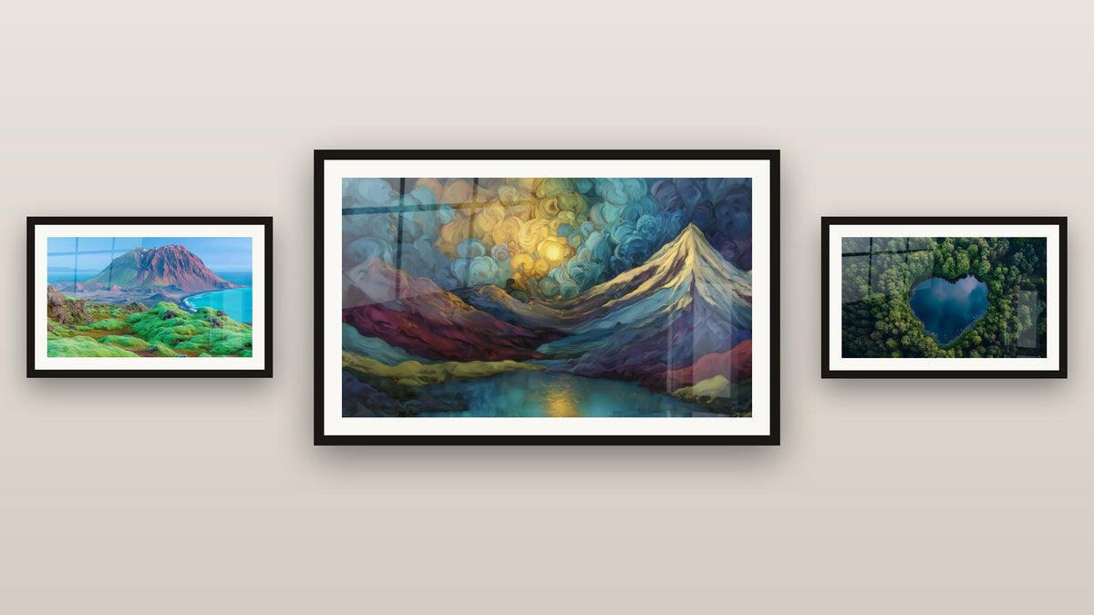 Gallery wall with three framed paintings, including Icelandic Volcanic Landscape and Illuminated Mountain Landscape