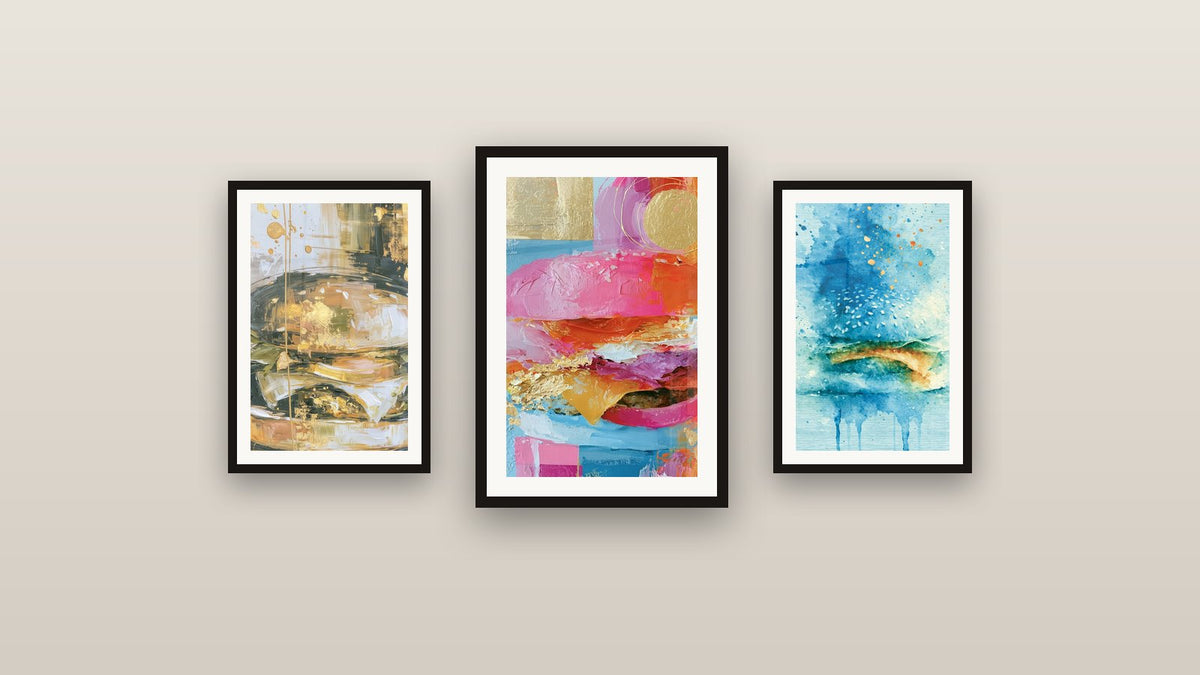Gallery wall with three framed paintings