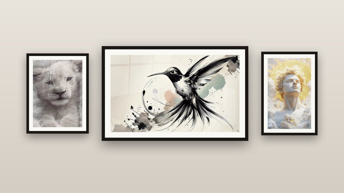 Gallery wall with three framed paintings, including Black & White Brilliance