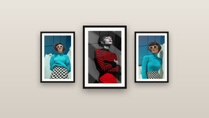 Galerijwand met drie ingelijste schilderijen