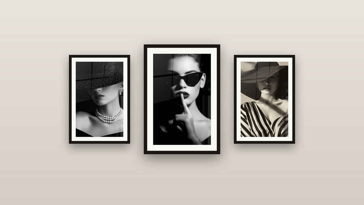 Gallery wall with three framed paintings, including Woman with Black Sunglasses Silent Gesture